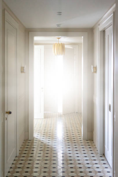 istock Sunlight from the slit door. White stylish corridor 1134262070