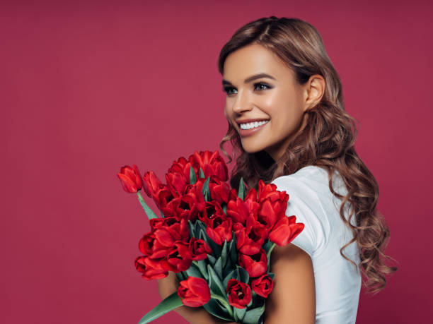 istock Beautiful woman with flowers 1134262426
