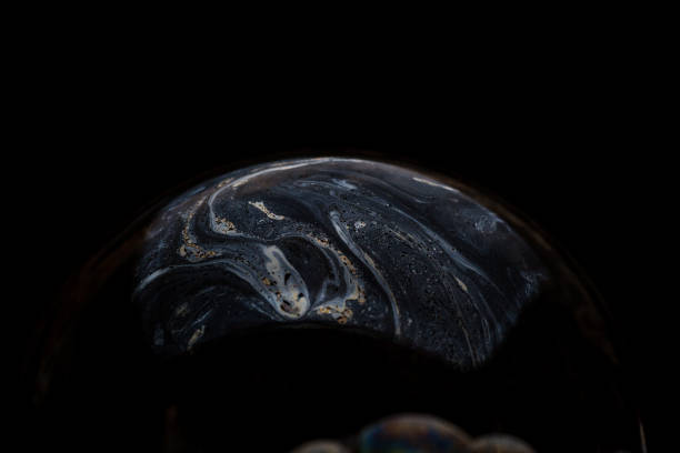 istock A bubble in rainbow colors on a black background. 1134262574