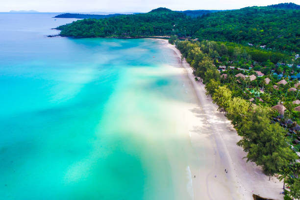istock White sand beach with resort aerial view 1134262759