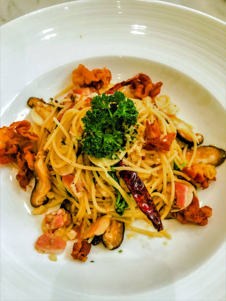 Spaghetti crispy bacon garlic.Dried chilli & white wine sauce.