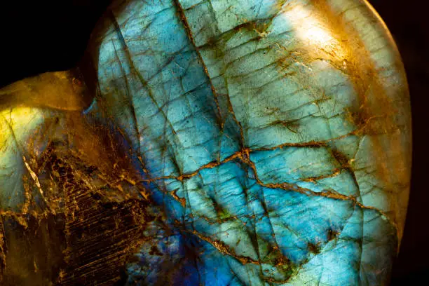 This is an extreme macro photo of a labradorite stone.  I used special lighting to illuminate it to bring out the colors and mineral textures.