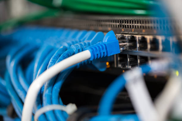 istock close up of blue cables connected to switches. 1134266471