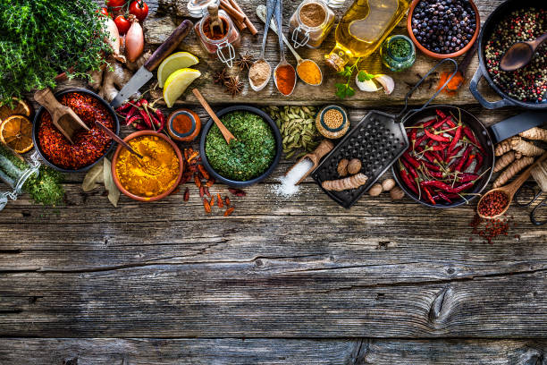 istock Spices and herbs frame shot from above on rustic wooden table 1134268574
