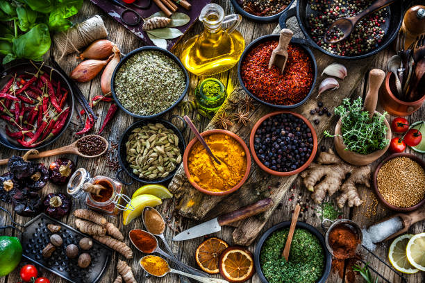 istock Spices and herbs shot from above on rustic wooden table 1134268584