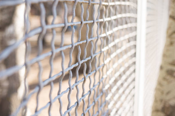 istock Close up wire fence gate feel like blocking and lacking of freedom 1134269284
