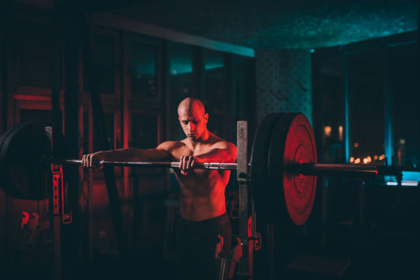 istock Shirtless body builder preparing for weightlifting 1134269342