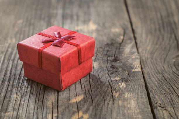 istock Red gift box on a wooden table 1134270812