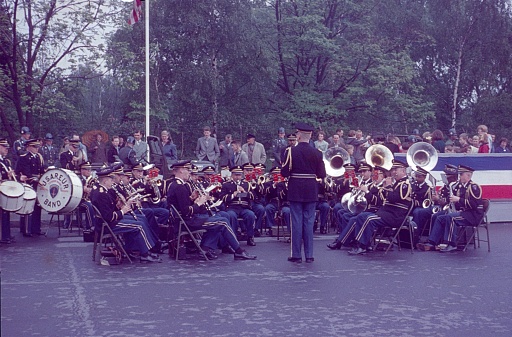 Zehlendorf, Berlin (West), Germany, 1960. Fourth of July celebrations on the Fourth of July road opposite the former McNair barracks. US military band plays for Independence Day in front of the Berlin audience and military personnel.