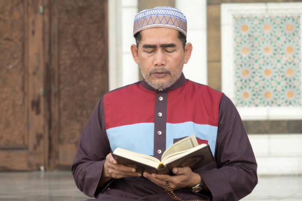 istock Mature Man Reading Koran While Sitting At Mosque 1134273354