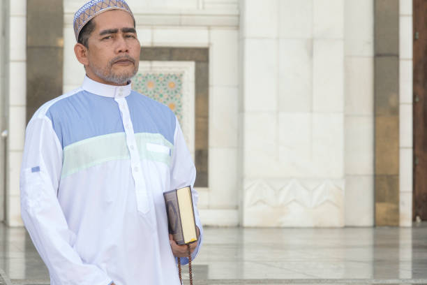 istock Portrait Of Man Standing At Mosque 1134273412