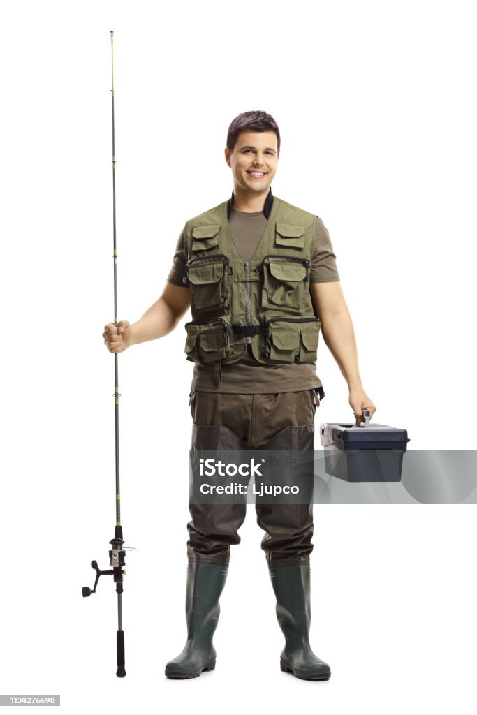 Portrait of a fisherman with a fishing rod on his shoulder on the