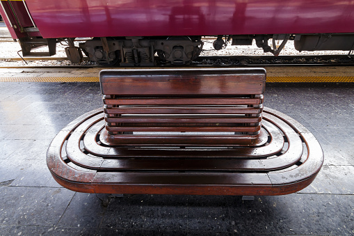 The old style train chair at the railway platform.