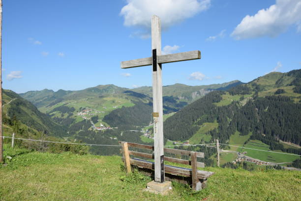 istock Cross and bench at the Bartholomaeusalpe 1134278987
