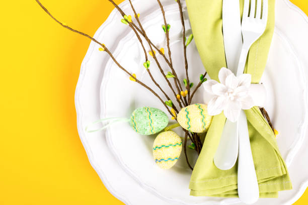istock Easter table setting  on a bright yellow background. Holiday decoration.Happy Easter concept. Top View. Flat Lay.Copy space for Text. 1134279568