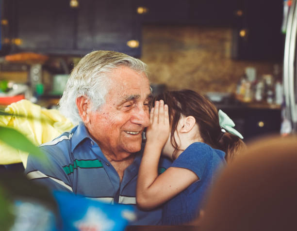 uscire con il bisnonno - whispering grandparent child grandfather foto e immagini stock