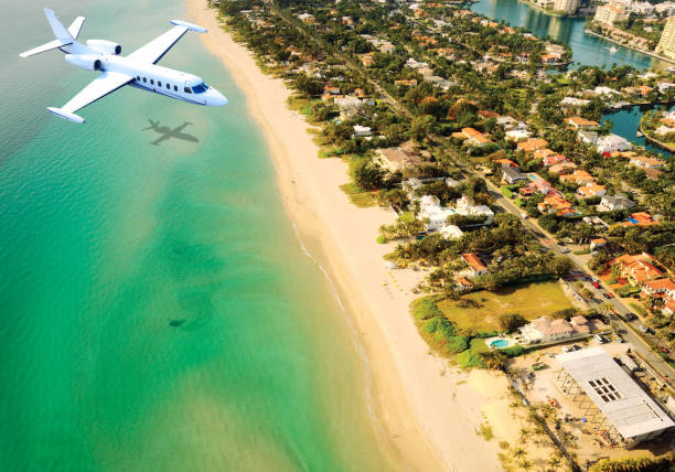 istock Airplane flying over Miami Beach, Florida, USA. 1134281176