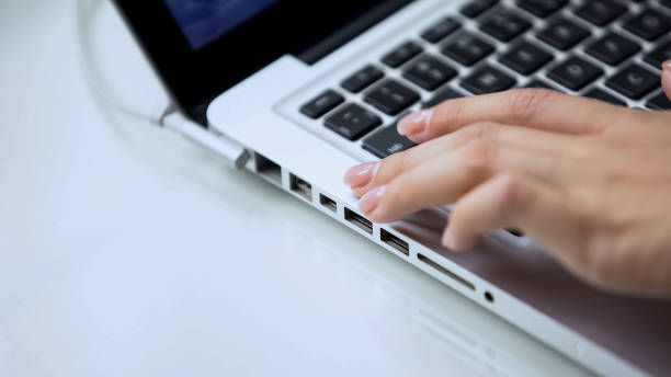 istock Female hand typing on laptop keyboard, personal computer use at office or home 1134281198