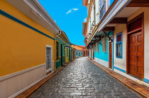 Cityscape in a colorful street of Guayaquil city, famous of its cobblestones and wooden colonial architecture, Las Penas district on Santa Ana Hill, Ecuador.