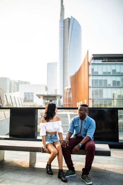 istock Couple sitting on a bench in Milan 1134282989