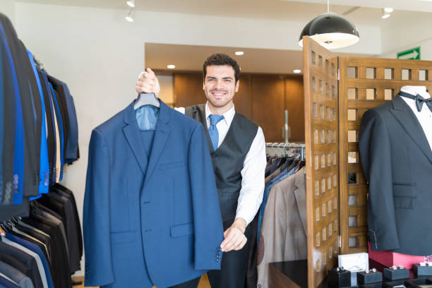 istock Owner Holding Blue Blazer In His Rental Shop 1134283343