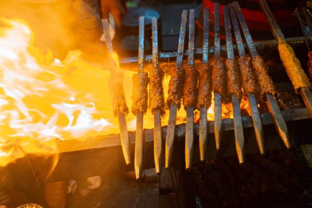 istock Chicken seekh kababs are being prepared road side 1134288190