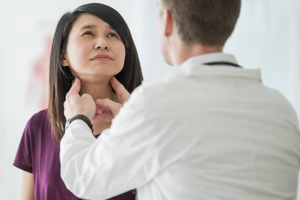 istock Female patient with throat concerns 1134289257