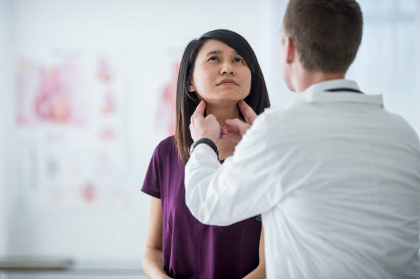 istock Female patient with throat concerns 1134289259