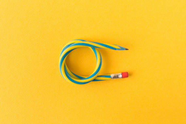 istock Flexible pencil . Isolated on yellow background. Bending pencil. 1134289308