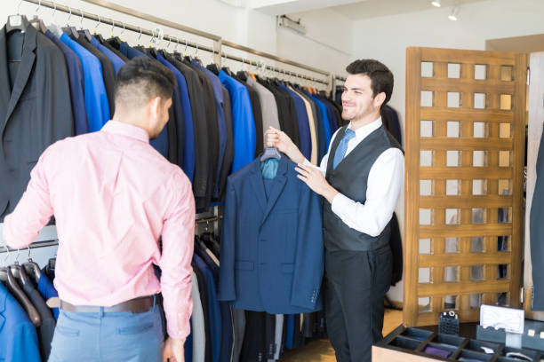 istock Assisting Customer In Buying Formals 1134289419
