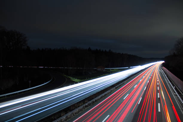 German Highway lights Highway lights at night in Germany. Long time exposure night freeway stock pictures, royalty-free photos & images