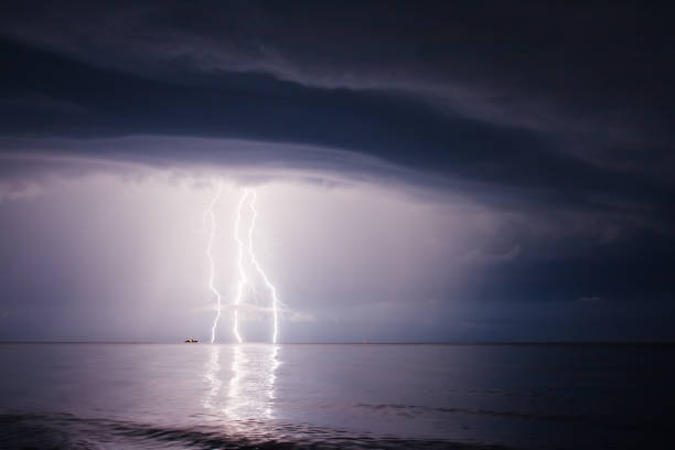 istock Dark ominous clouds. Summer storm beginning with lightning 1134289935