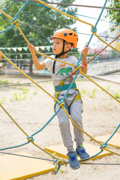 istock Boy at climbing activity in high wire forest park. Table Mountain Cableway kids special on again. 1134290044