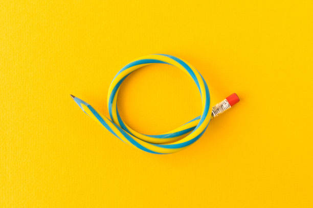 istock Flexible pencil . Isolated on yellow background. Bending pencil 1134290093