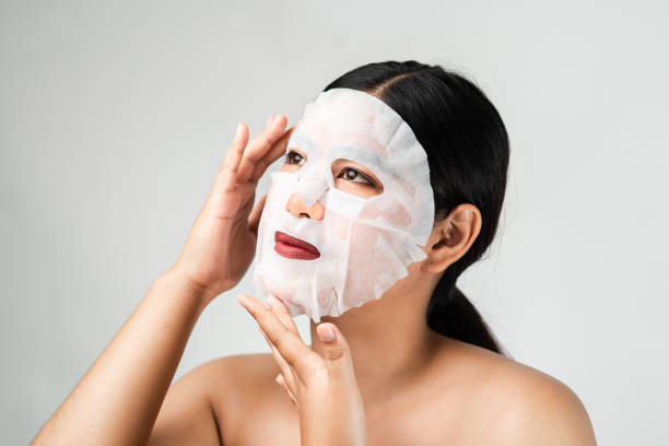 istock Woman using white mask on her face, lifestyle concept. 1134290805