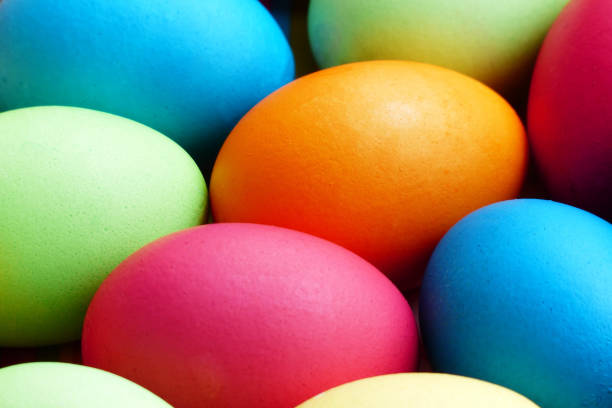 istock Many colorful eggs in a easter nest close up. 1134291207