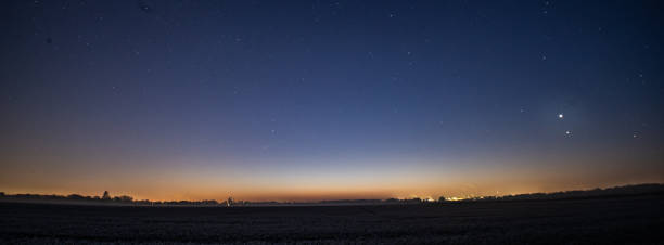 starry sky at sunrise horizon starry sky at sunrise weltall stock pictures, royalty-free photos & images