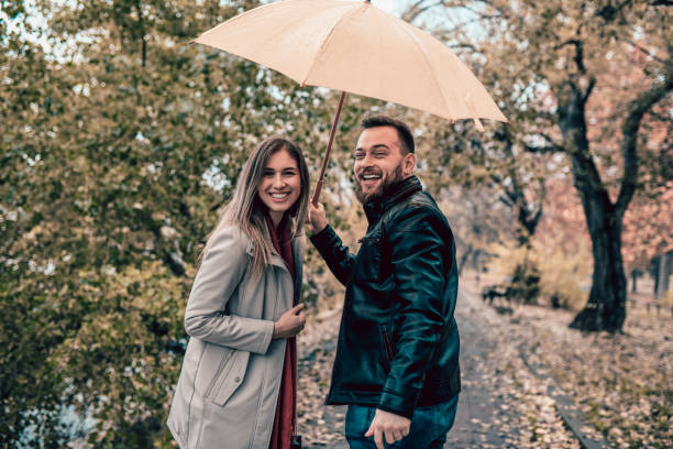 istock Cute Romantic Couple Enjoying Rainy Weather 1134291609