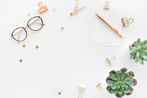 Elegant work table with business accessories on withe background.luxury feminism style