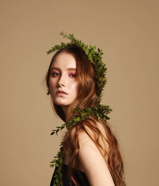 istock Beautiful young woman with leaves wreath 1134292646