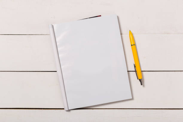 istock Mock-up magazine or catalog on wooden table. Blank page or notepad on wood background. Blank page or notepad for mockups or simulations 1134294024