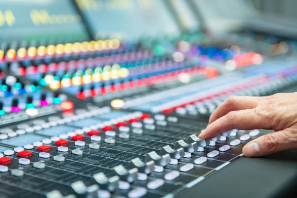 istock Audio system for professionals. Close-up view of sound engineer adjusting digital audio mixing console. Sound recording studio 1134295296