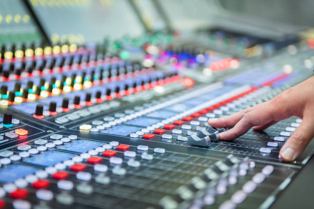 istock Audio system for professionals. Close-up view of sound engineer adjusting digital audio mixing console. Sound recording studio 1134295298