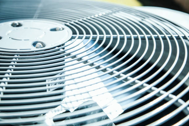 Home air conditioner unit in summer season. Top view of an air conditioner unit outdoors in hot summer season.   No people. electric fan stock pictures, royalty-free photos & images
