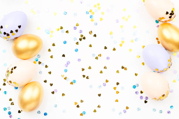 istock Festive Happy Easter background with decorated eggs, flowers, candy and ribbons in pastel colors on white. Copy space 1134299670
