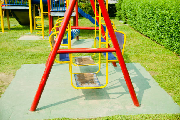 istock Metallic swing chairs for children around a park 1134301139