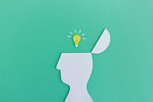 istock Bright idea: Paper man with glowing light bulb in head 1134301245