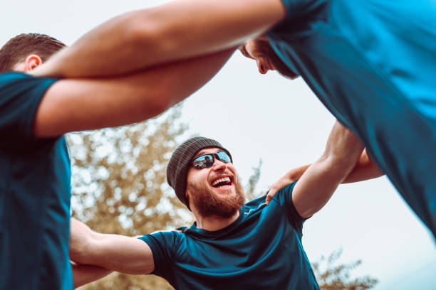 istock Team Of Athletes Motivating Each Other Before Training In Park 1134301375