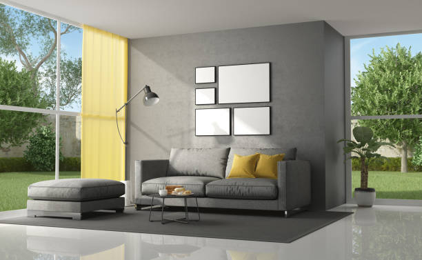 Living room of a modern villa with gray sofa with yellow cushion - 3d renderingNote: the room does not exist in reality, Property model is not necessary