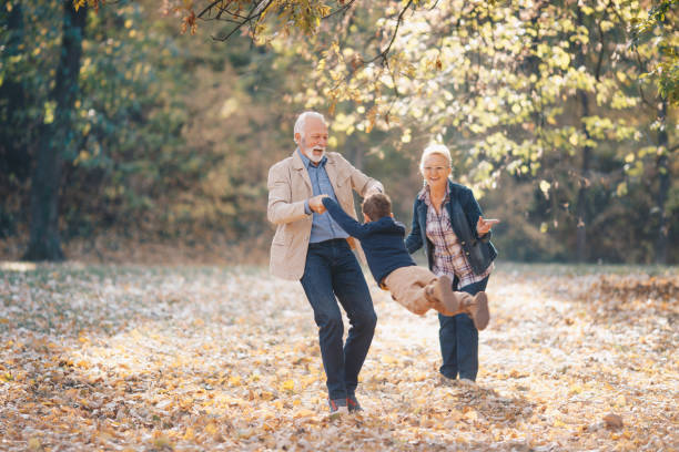 giocoso con i nonni - grandparent grandfather grandmother child foto e immagini stock